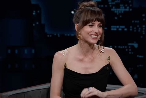 dress oops|Dakota Johnson's dress falls off during 'Jimmy Kimmel Live' .